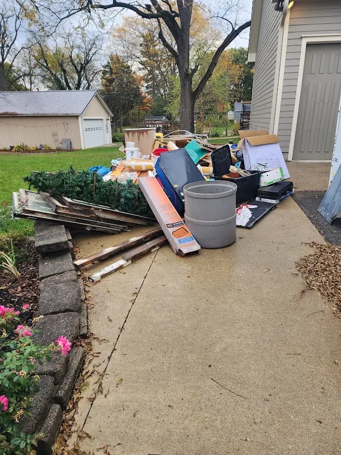 Dumpster being loaded with debris for Roofing Dumpster Rental in Ladera Heights